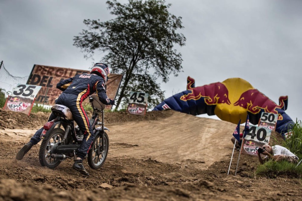 Daniil Kvyat climbs the hill with his moped at the Red Bull Epic Rise preshoot at the Crossdromo Vincenzo Agusta in Ciglione della Malpensa, Italy, on September 3rd, 2014.